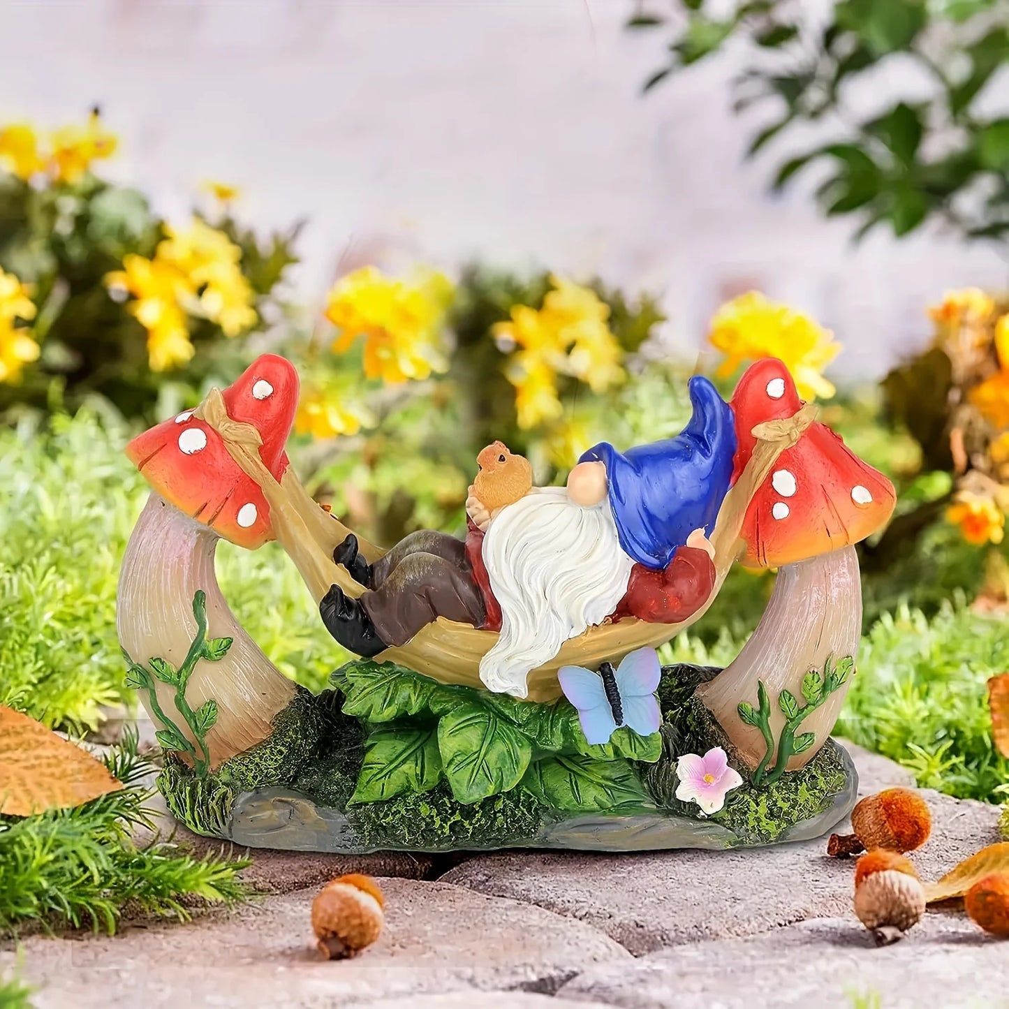 Solar Gnome Figurine Lying on Hammock with Bird and Mushroom